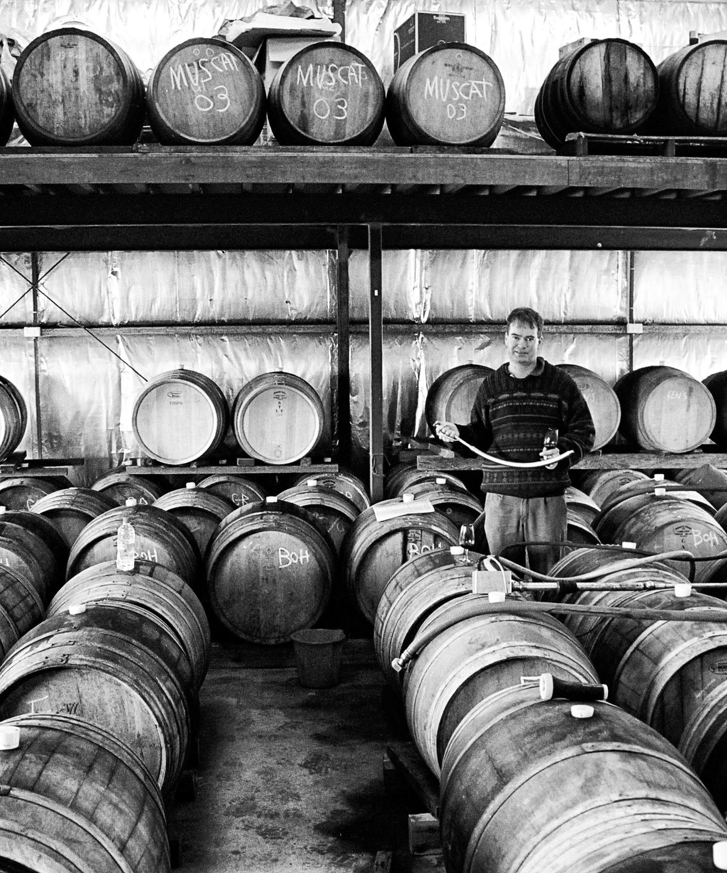 Jeffrey Grosset ith glass of Cooper's Pale seated outside The Rising Sun, Auburn, Clare Valley, South Australia c. 2000